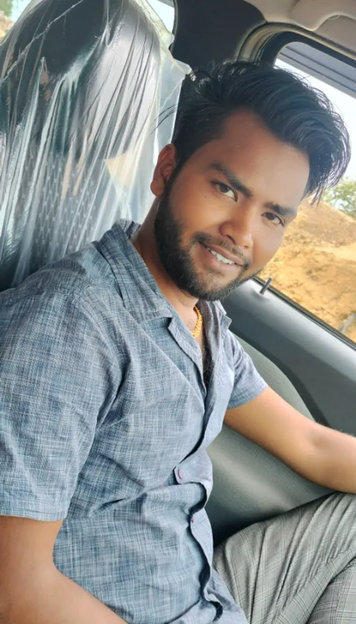 a man sitting in the passenger seat of a car