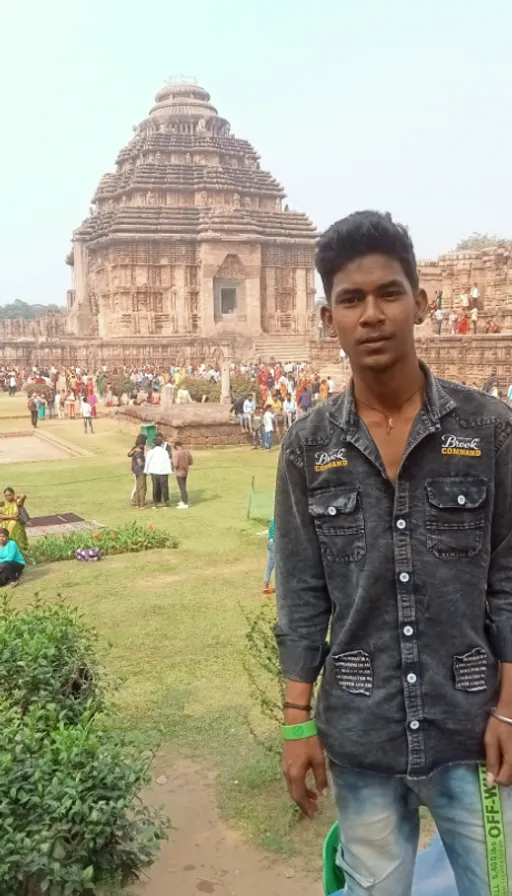 a man standing in front of a large building