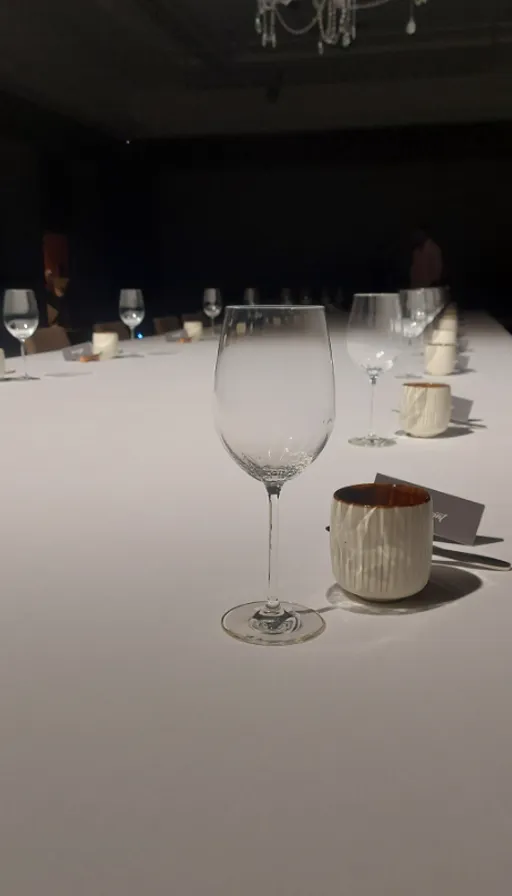 a table with a wine glass and a wine glass on it