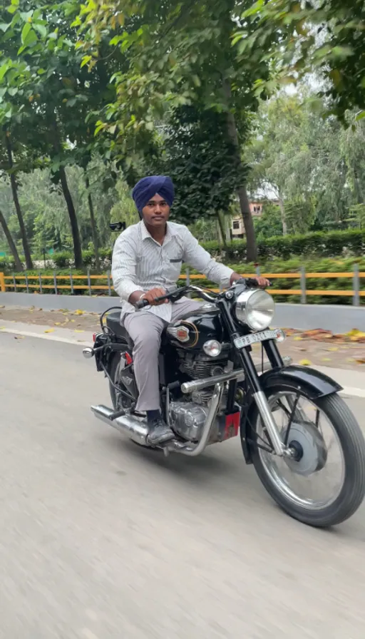 a man riding a motorcycle down a street