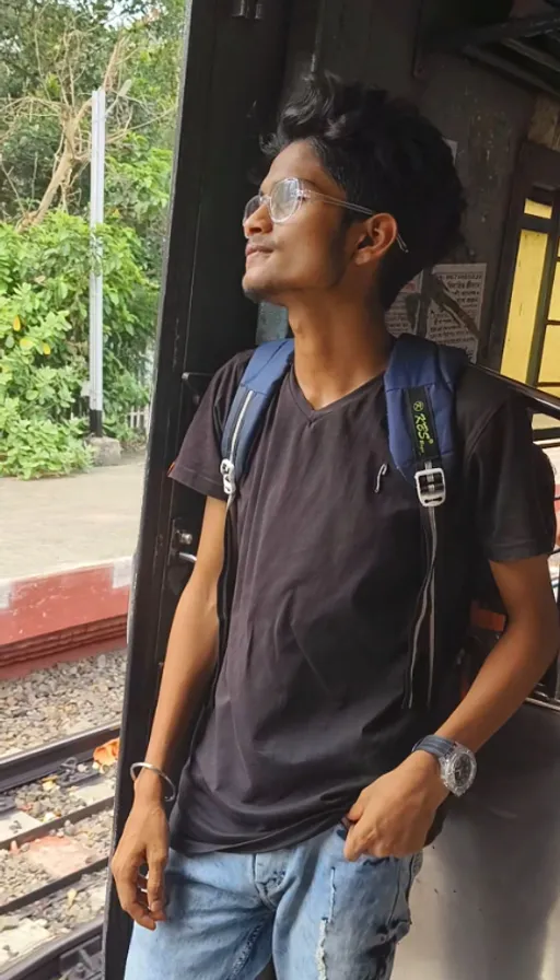 a man with a backpack standing on a train