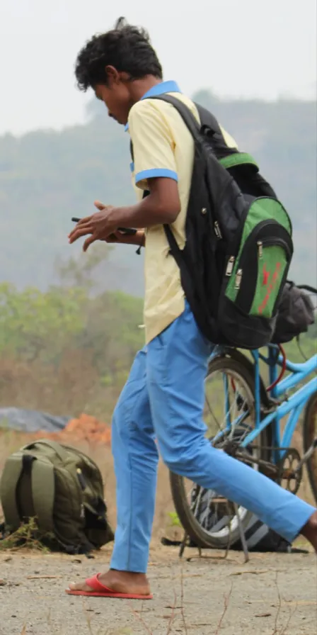 a man walking with a backpack on his back