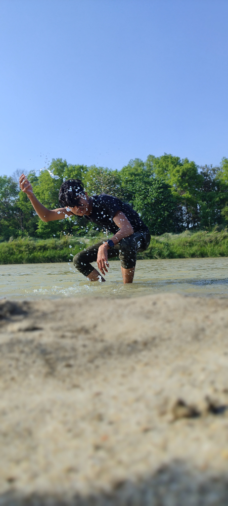 a man riding a skateboard on top of a sandy beach