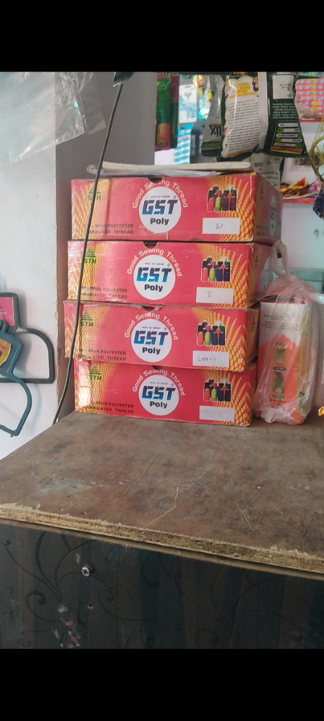 a stack of boxes sitting on top of a wooden table