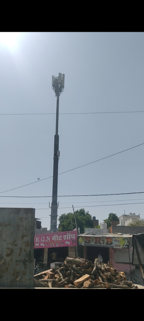 a street light on a pole in the middle of a city