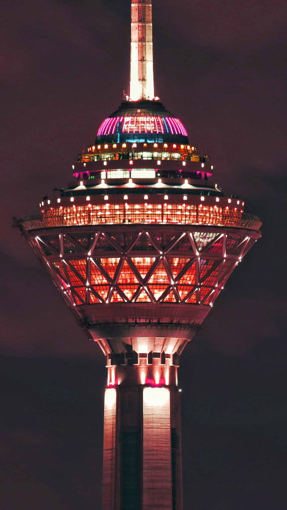 a very tall tower lit up at night