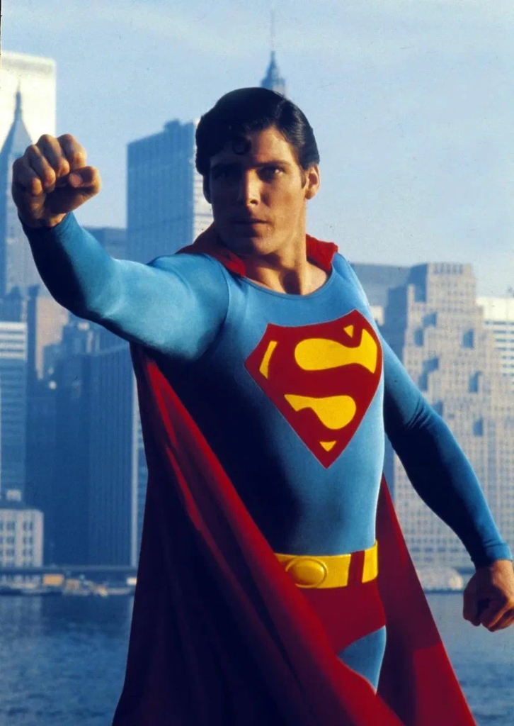 a man in a superman costume standing in front of a city