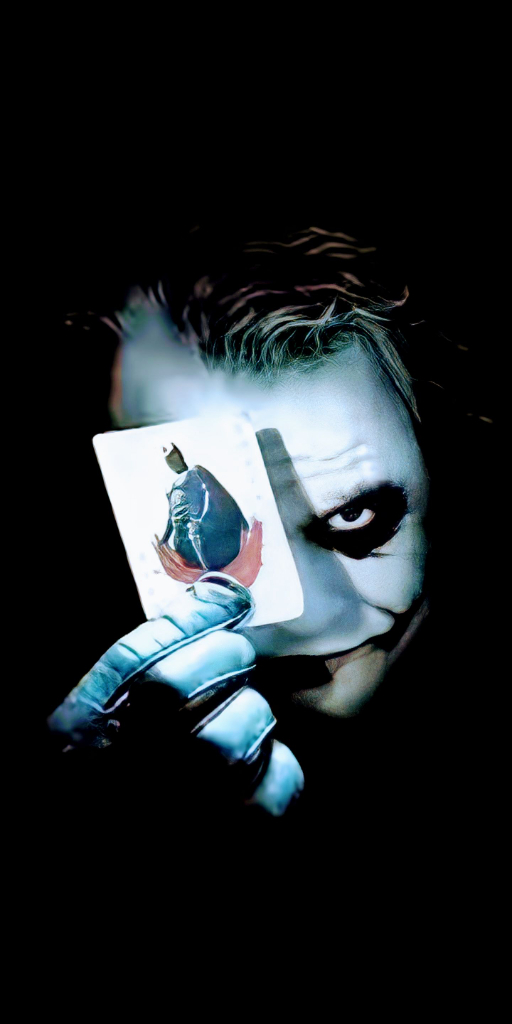 the joker holding up a card in his hand