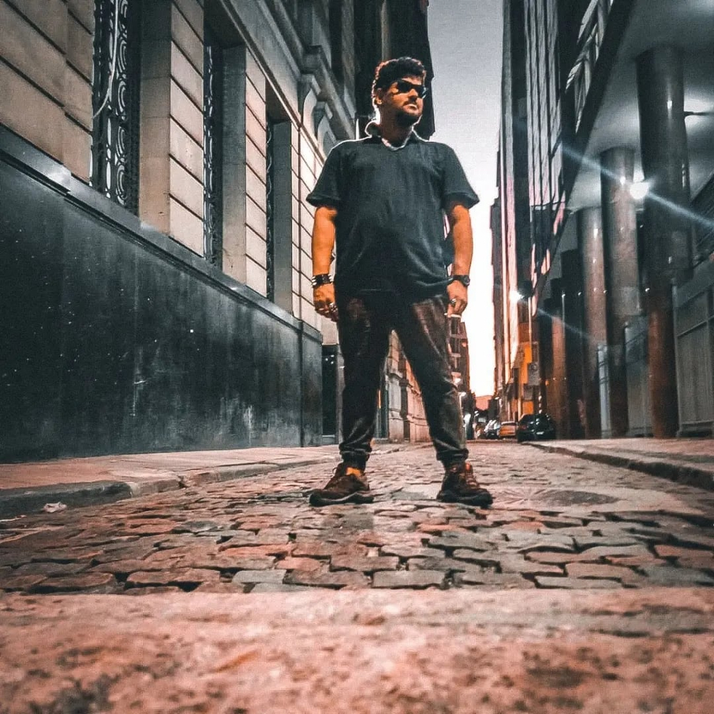 a man standing in the middle of a street