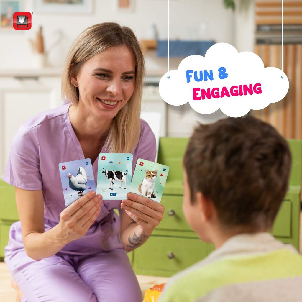 a woman playing cards with a young boy