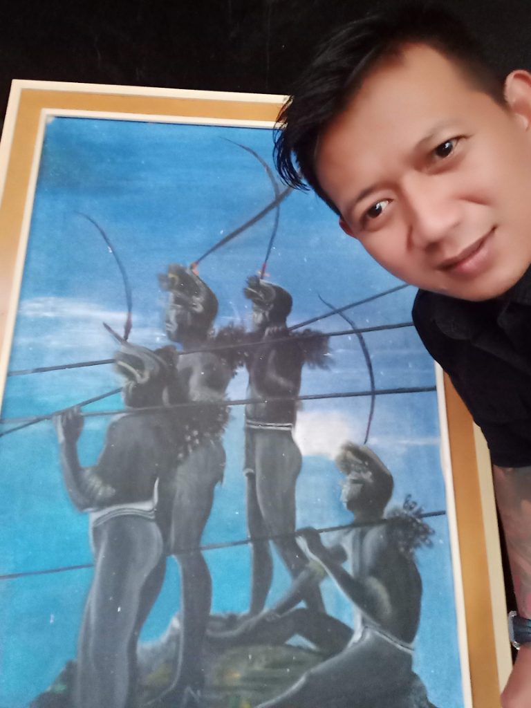 a man holding up a picture of a group of people