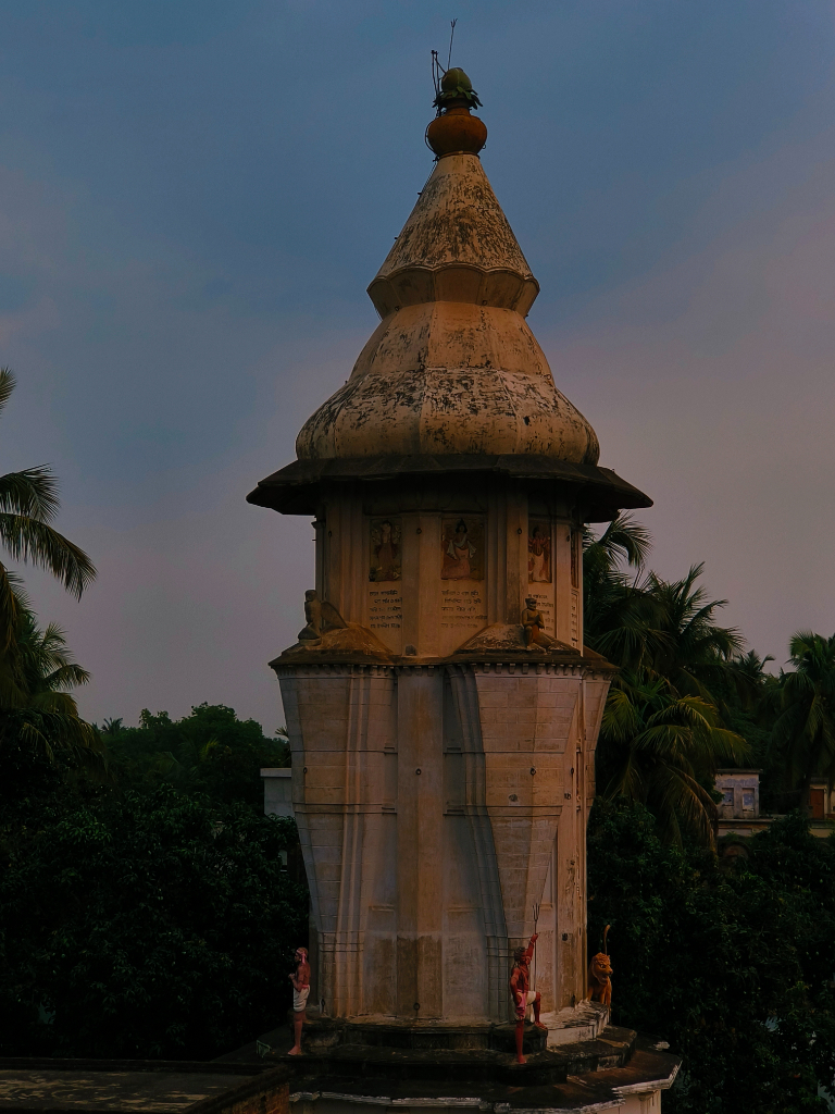 a tall tower with a clock on top of it