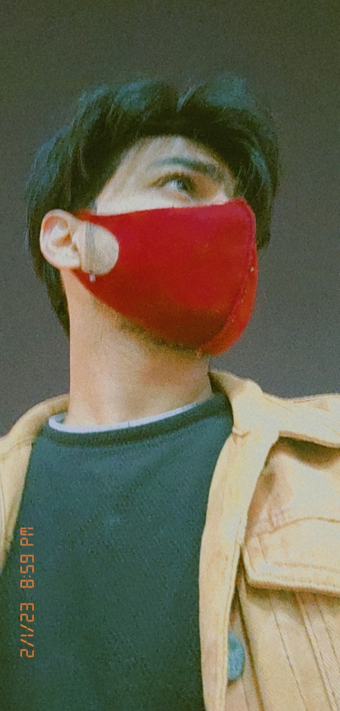 a man with a red mask on his face