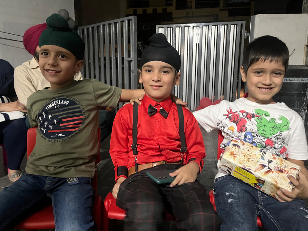 a group of young boys sitting next to each other