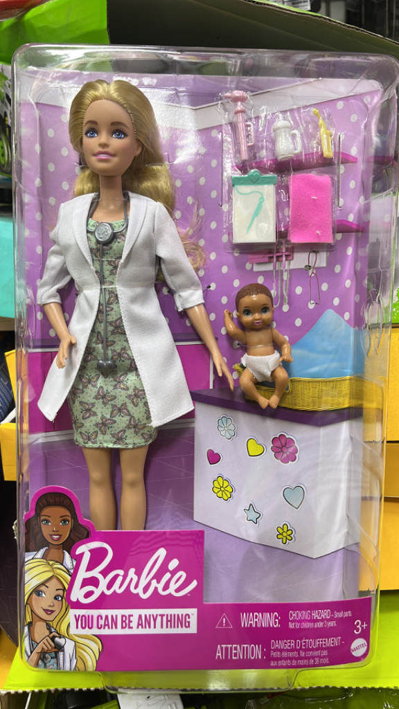 A barbie doll with a baby doll in a box. Animate the figure