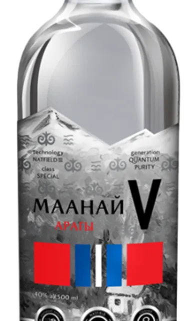 a bottle of vodka with a mountain in the background
