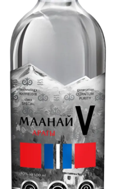a bottle of vodka with a mountain in the background